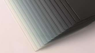 Stack of glass panels in different shades of gray