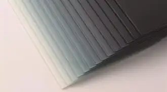 Stack of glass panels in different shades of gray