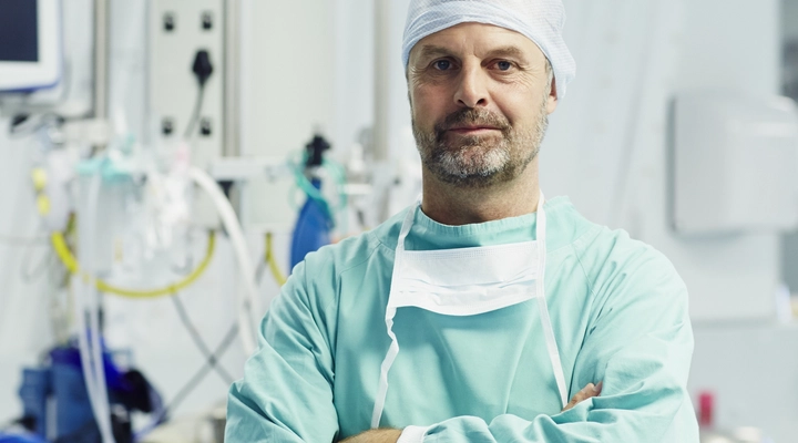 Medical professional in a hospital surrounded by equipment