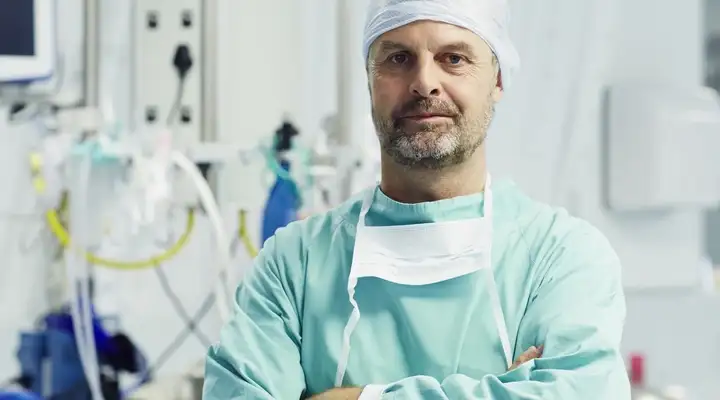 Medical professional in a hospital surrounded by equipment