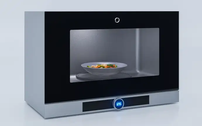 A modern microwave oven with a clear view inside to the food.
