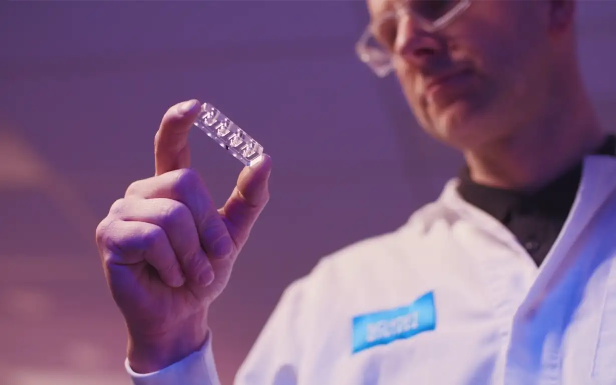 Researcher looking at a diagnostic device