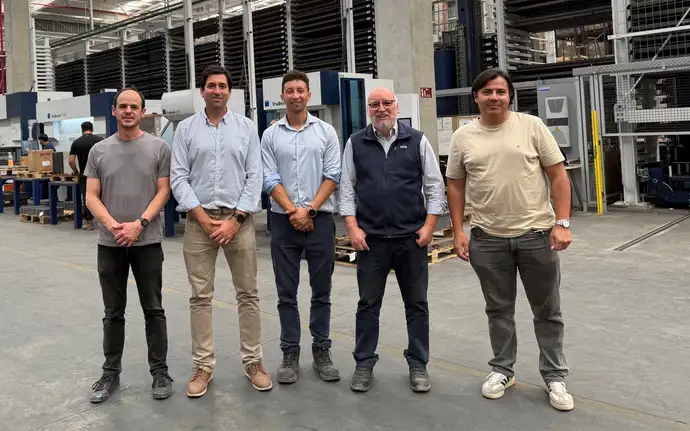 5 colleagues from Bosca standing in a production hall
