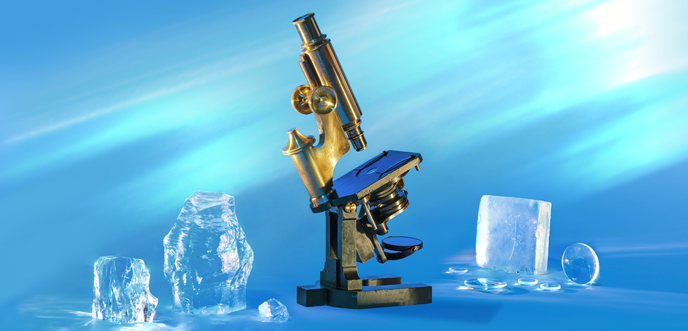 Brass microscope and rough glass shapes	