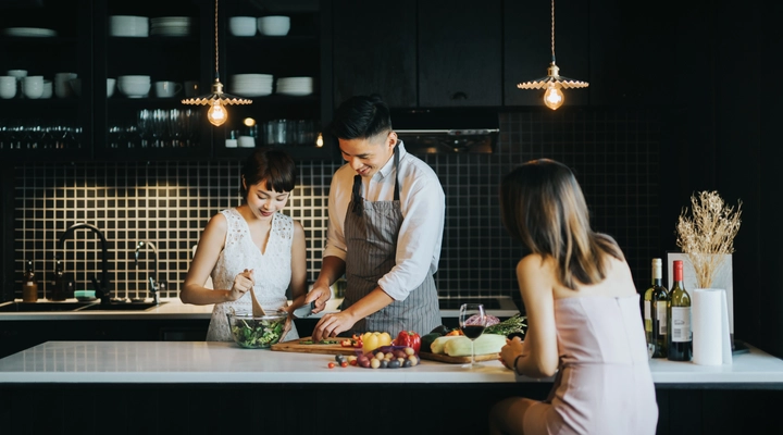 Family in kitchen cooking and preparing food