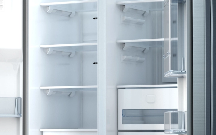 Empty double refrigerator with open doors