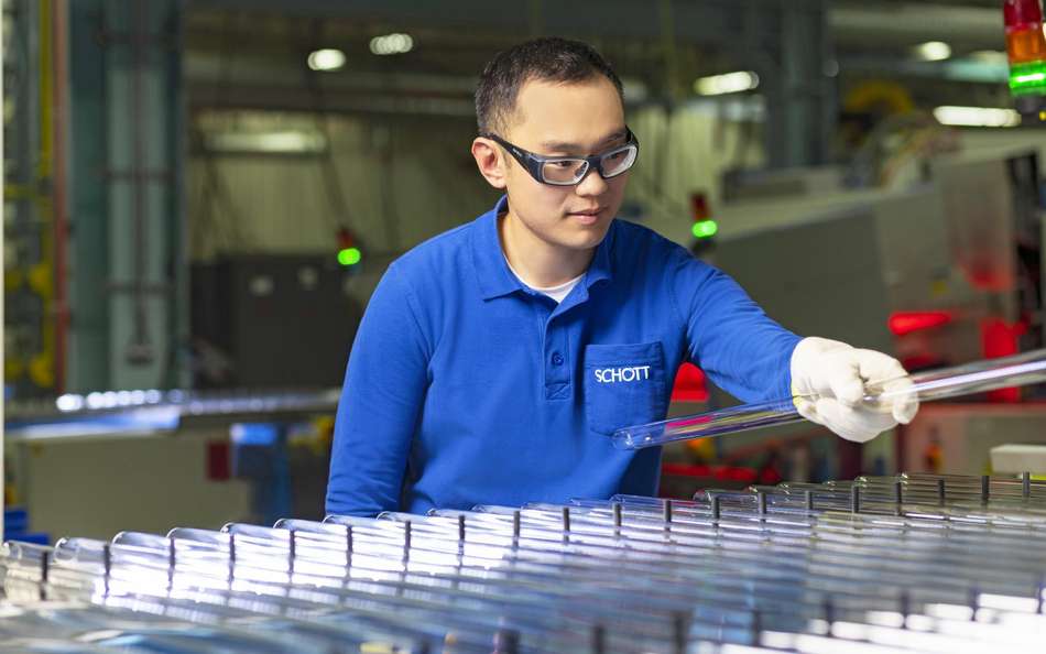 SCHOTT engineer inspects a line of pharmaceutical glass tubing in Jinyun, China