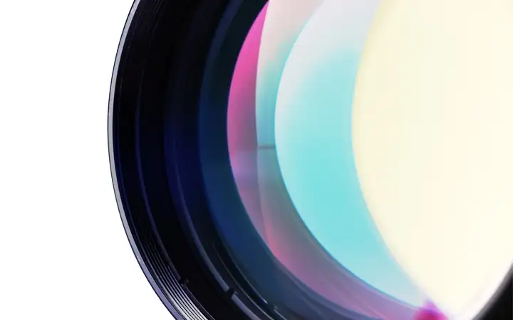 Series of black, magenta and blue discs showing different optical coatings