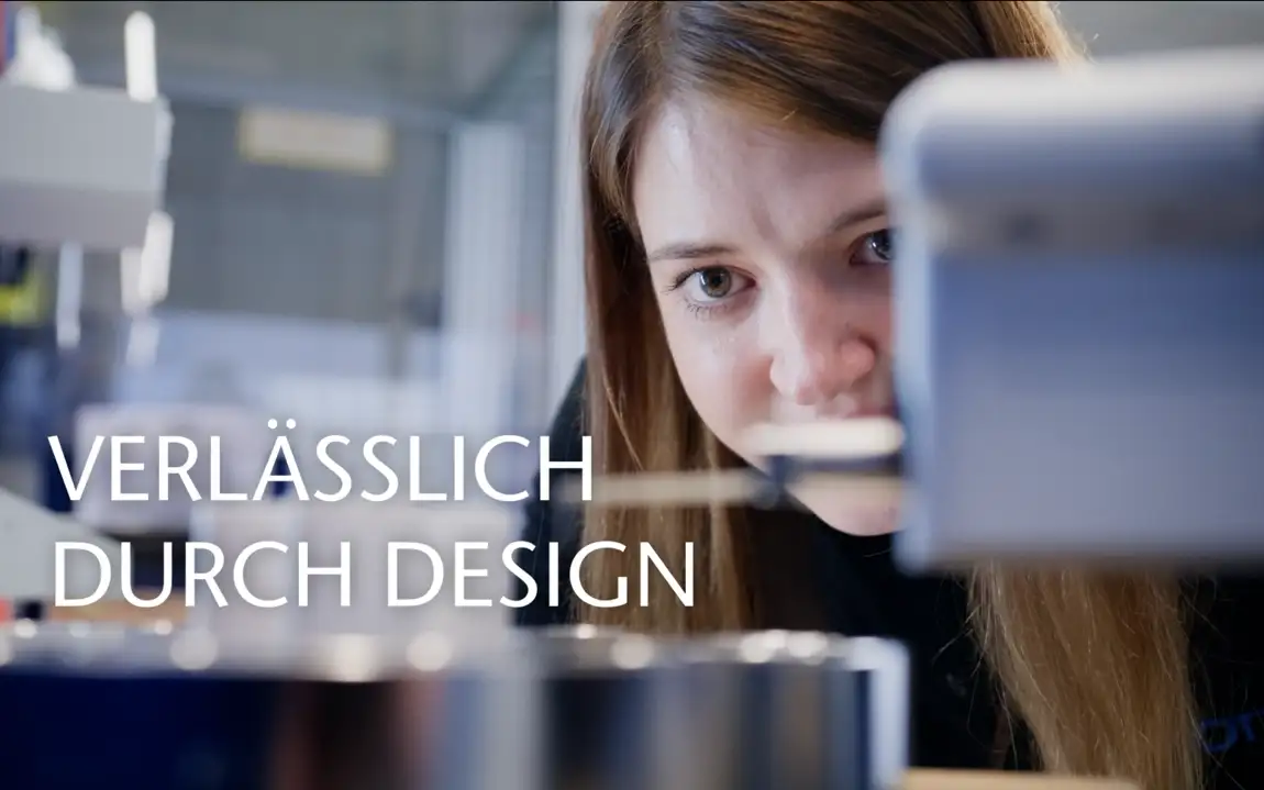 Technician inspects dimensions of a large feedthrough with precision instrumentation