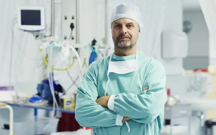 Medical professional in a hospital surrounded by equipment