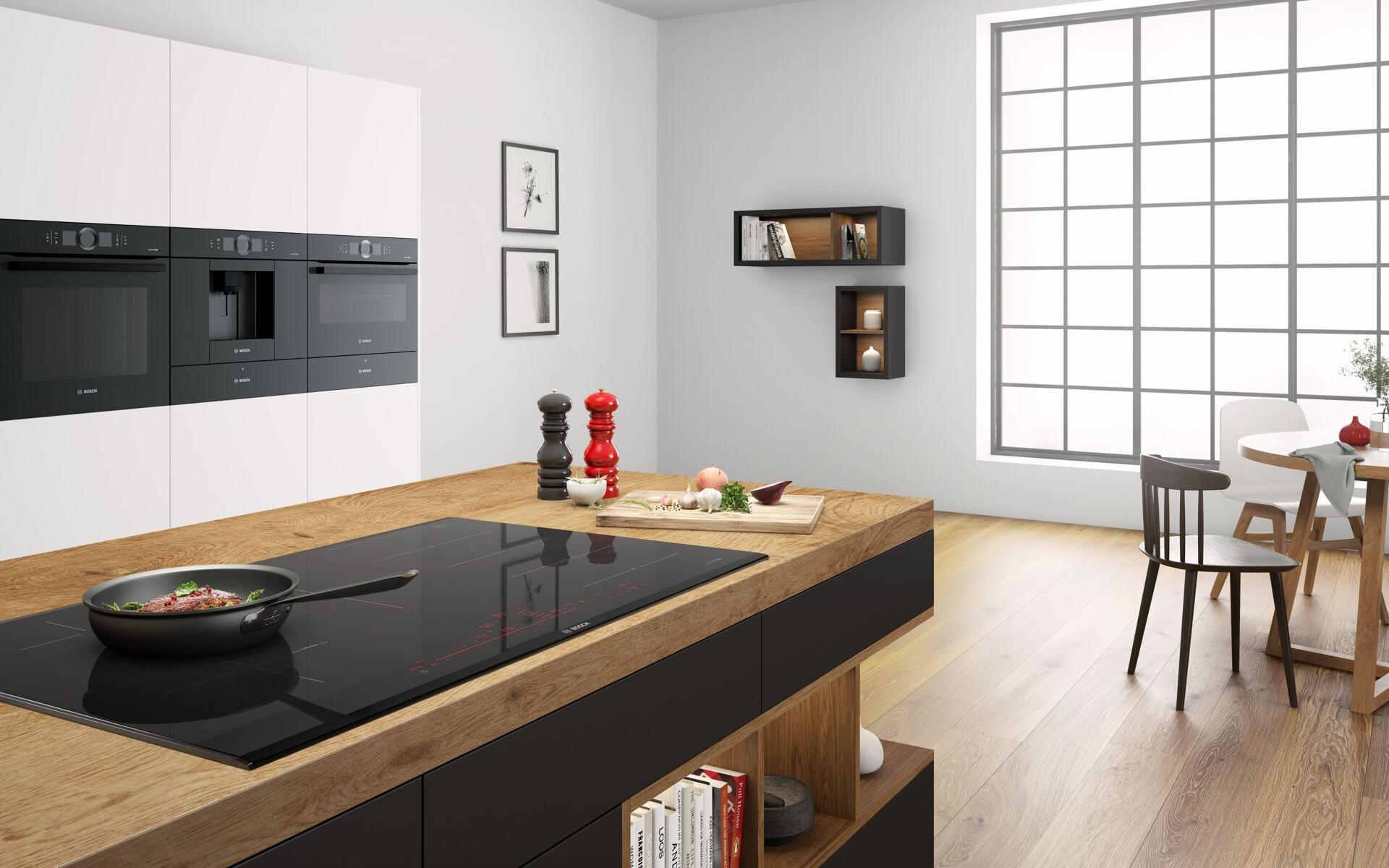 Modern white kitchen featuring a SCHOTT CERAN Miradur® glass-ceramic cooktop