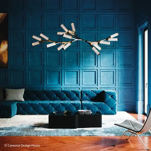 Lounge area with blue walls and modern glass chandelier