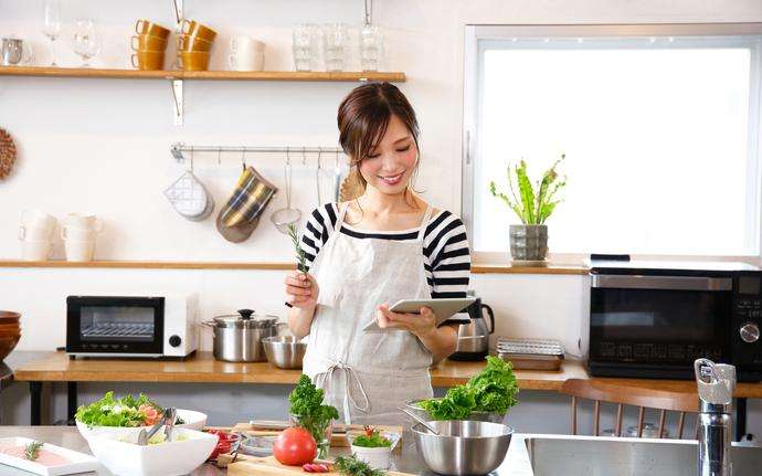 Asian woman housewife cooking in the kitchen