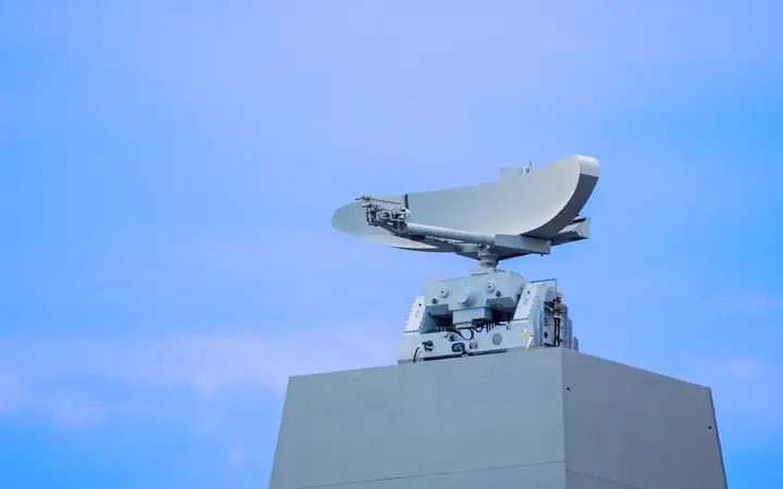 Radar dish on top of a building