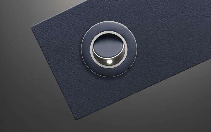 Round Opal reading light for aircraft cabins in blue leather