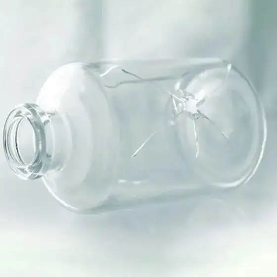 Glass vial cracked and on its side 