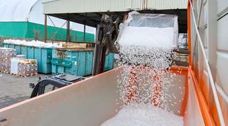 The medicine vials are poured from the wire box into the container by a forklift truck at sanofi	