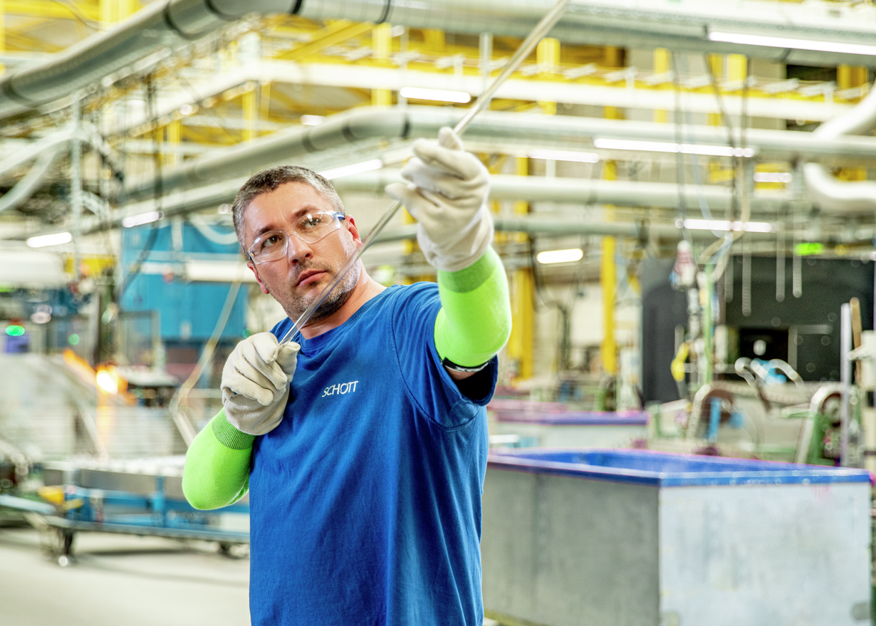 Man with pharmaceutical glass tube