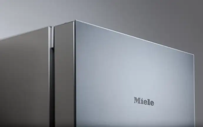 Modern Miele refrigerator with a matt effect glass panel