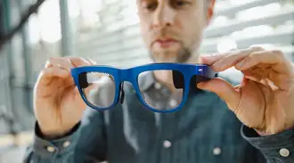 A man holding a prototype of AR glasses
