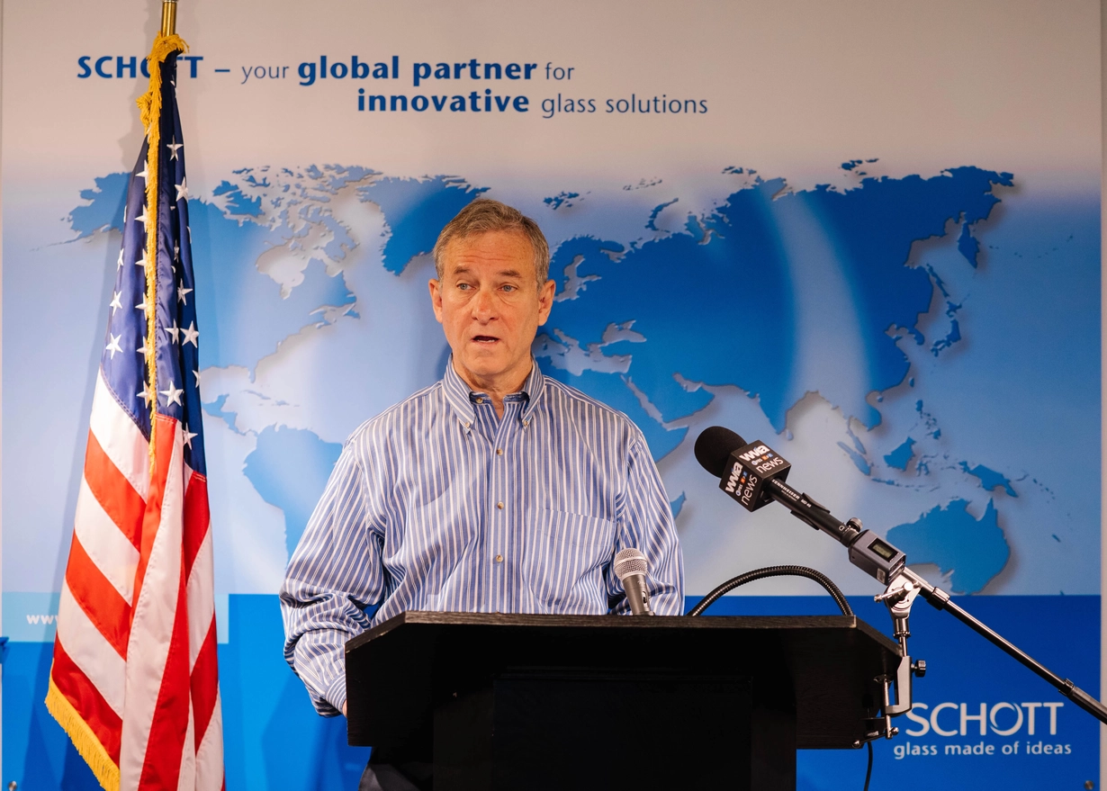 Man standing at podium speaking