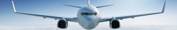 Front view of an aircraft in a blue sky