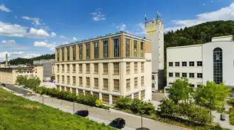 Side view of main building of The Valley business center in Kemptthal, Switzerland