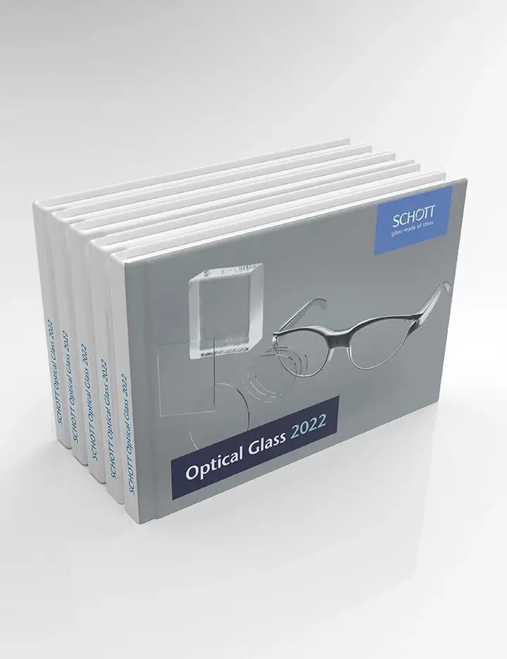 Five copies of the SCHOTT Optical Glass Pocket Catalog 2022