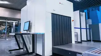Very large X-ray machine used for cargo inspection set in an industrial environment