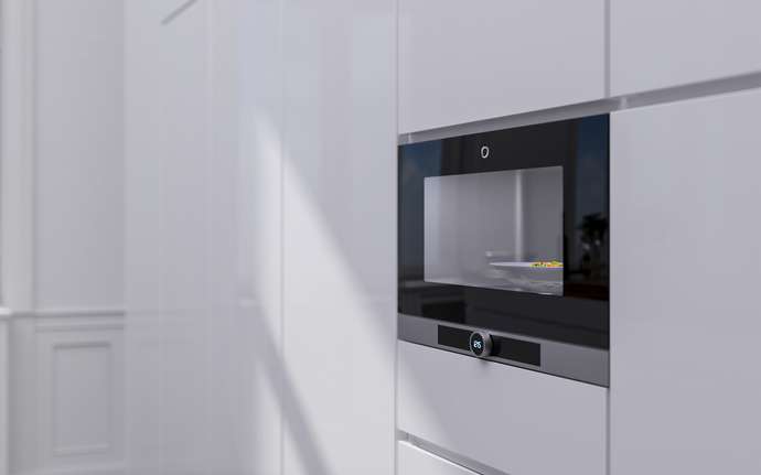 Built-in microwave oven in a modern white kitchen with a clear view to the food.