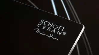 Black Glass-ceramic cooktop panel edge with CERAN Miradur Logo on black background