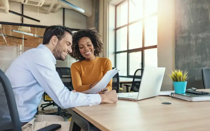 Male and female working together in a business meeting