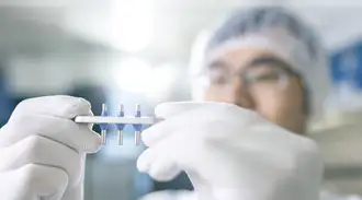 Men holding a compressor terminal with white gloves