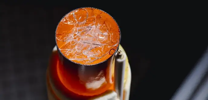 Glass shards lie on top of already melted, orange-glowing glass in the rotational viscometer