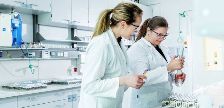 Two women standing in the lab