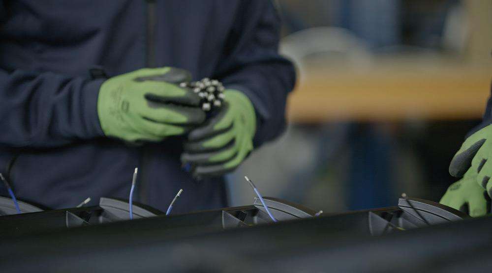Engineer making series of HEATSCOPE® PURE heaters in a factory