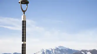 Top of a solar-powered street light with blue sky background