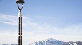 Top of a solar-powered street light with blue sky background