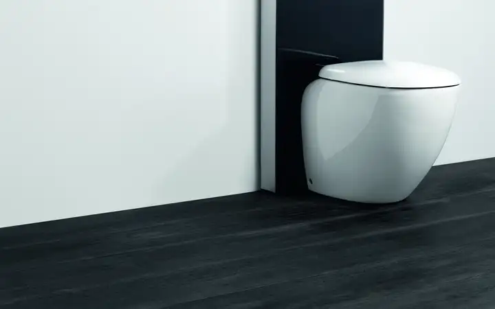 Wall-hung white toilet in a modern bathroom