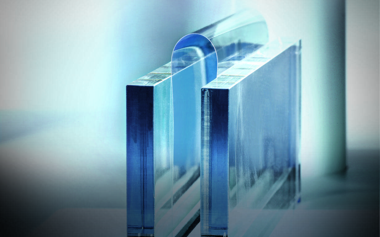 Sample of Xensation® Flex ultra-thin glass being tested for flexibility in a lab