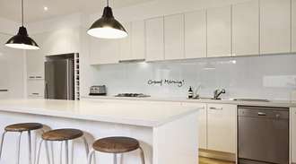 Modern kitchen with glass backsplash 