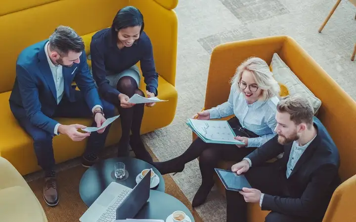 Group of office workers talking in a meeting