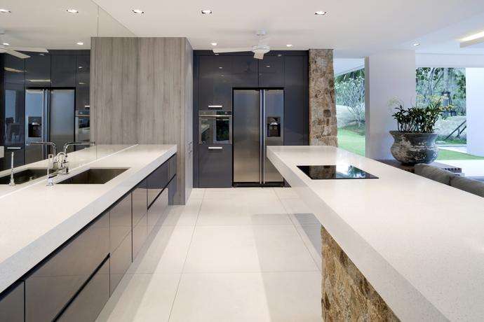 Modern kitchen with white tiles and gray appliances