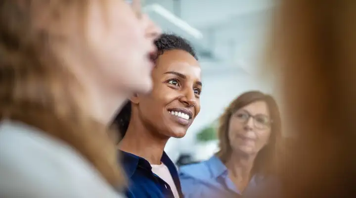 Three women talking in a business meeting