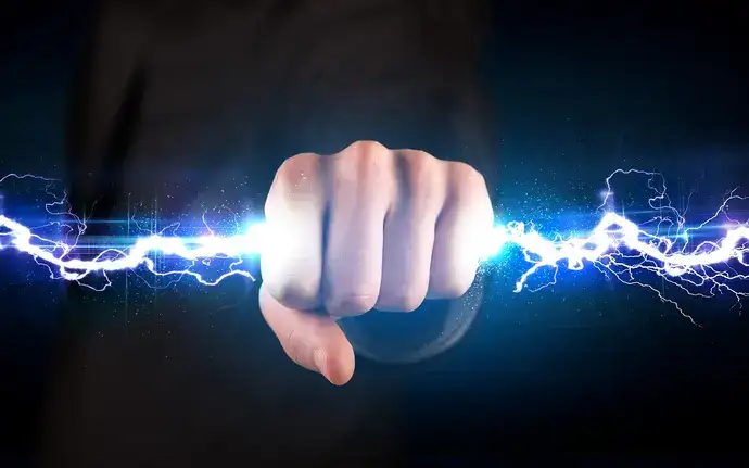 A hand holding an electrical bolt