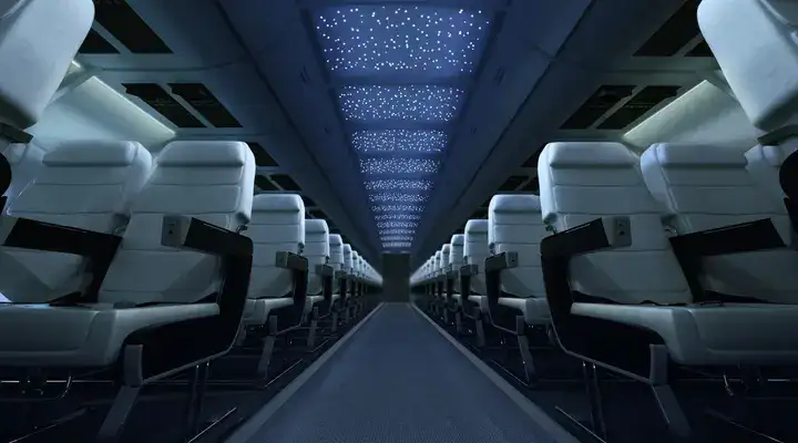 Interior of an aircraft at night lit up by the SCHOTT Star Ceiling aircraft cabin lighting system
