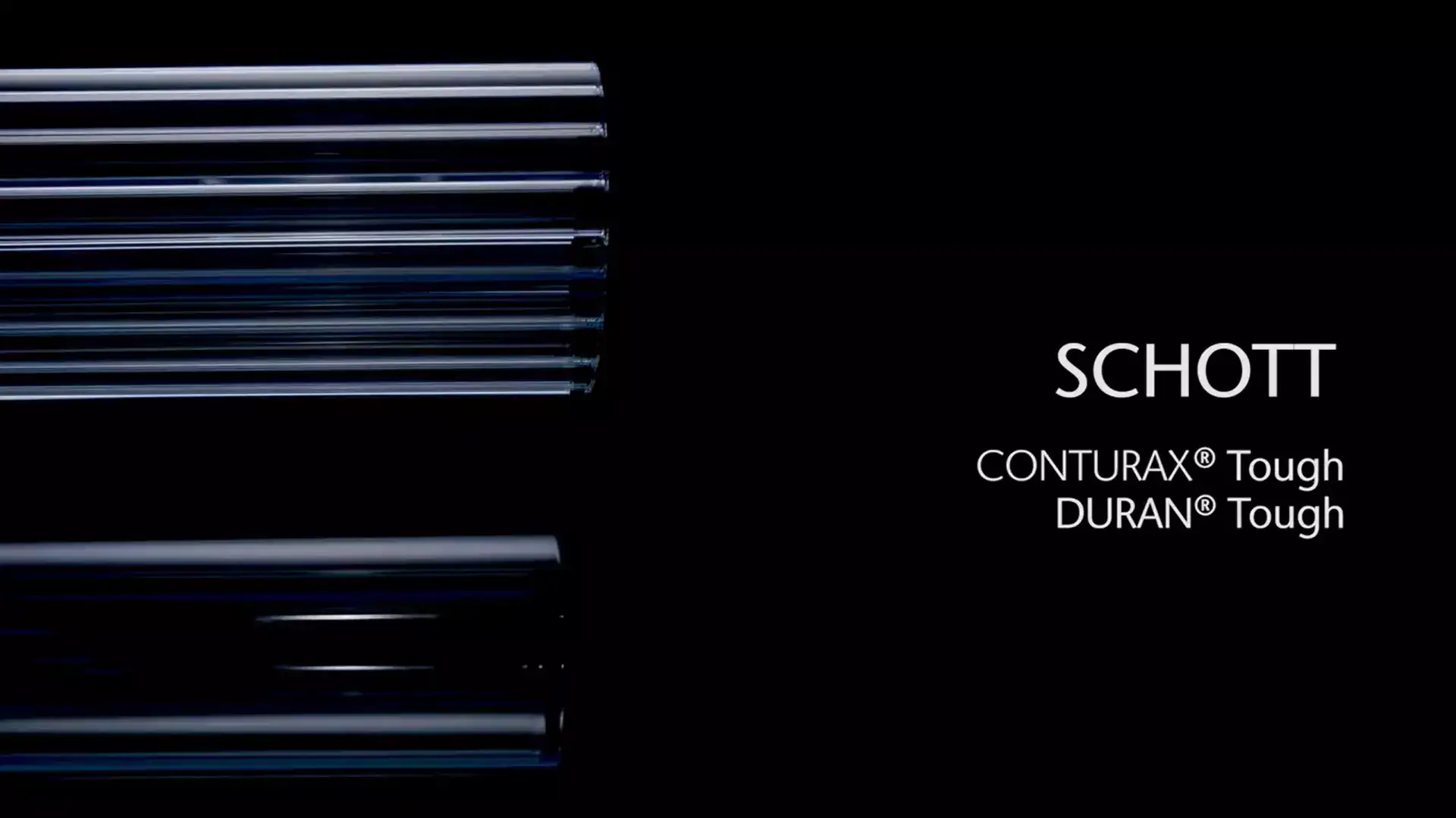 Fileira de tubos de vidro CONTURAX® Tough e DURAN® Tough da SCHOTT em um fundo preto	