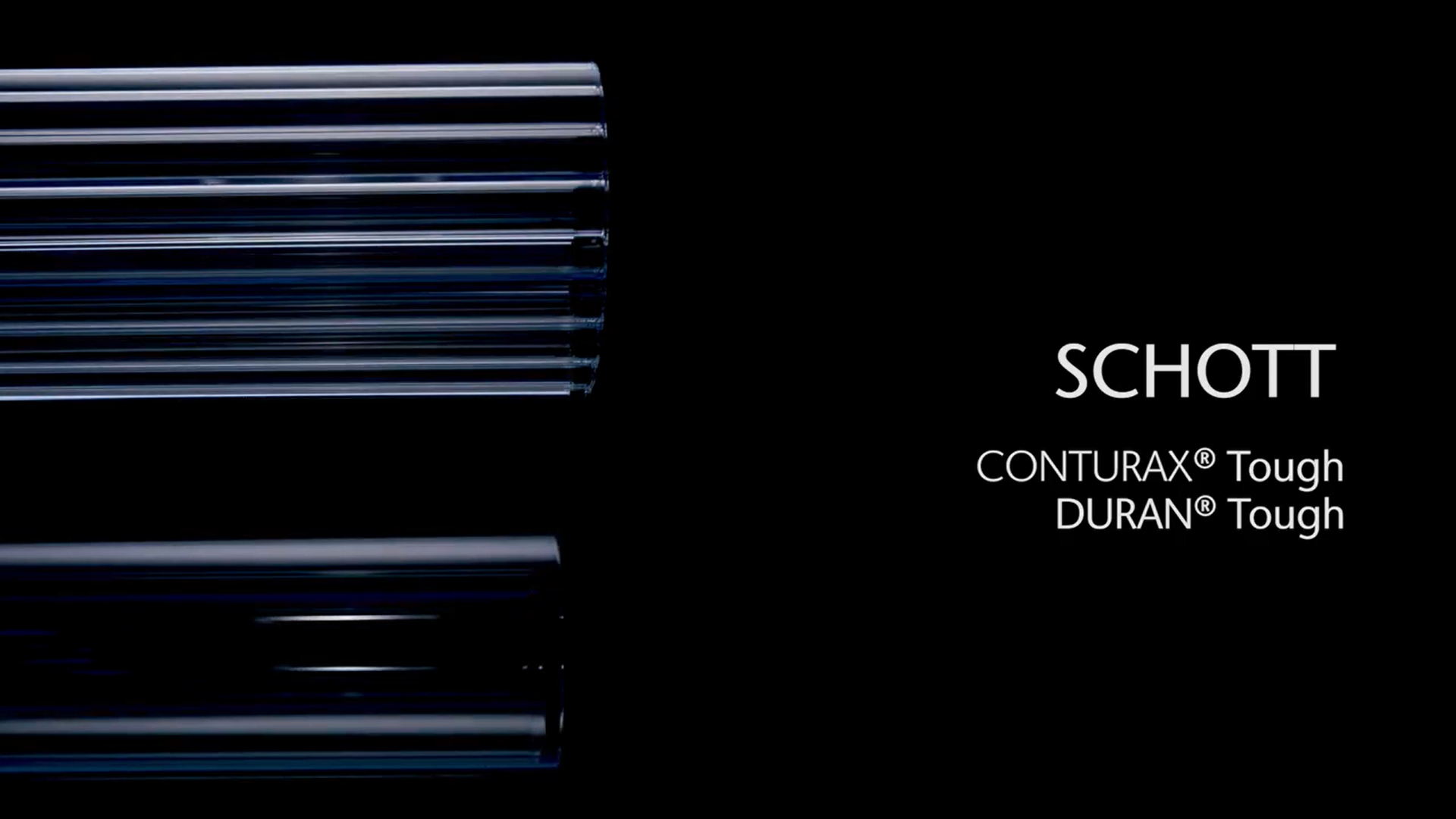 Fila de tubos de vidrio CONTURAX® Tough y DURAN® Tough de SCHOTT sobre un fondo negro	