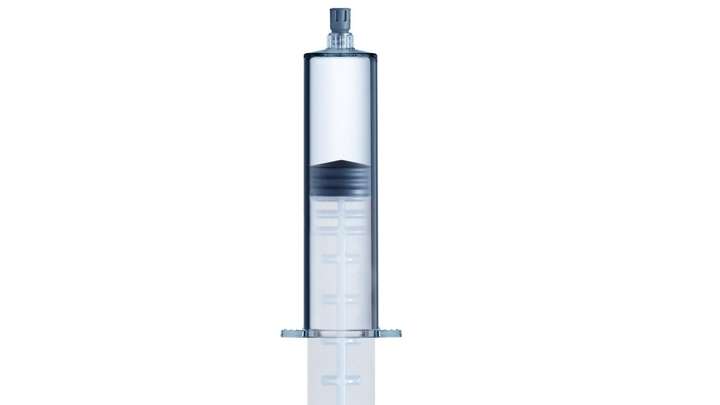 A 50ml COC polymer prefillable syringe including tip cap and plunger rod