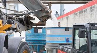 The vials are poured into a tub by the excavator on the SCHOTT premises	